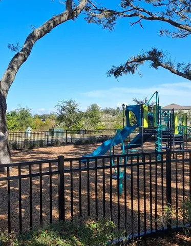 a kitchen with stainless steel appliances granite countertop a sink a stove a microwave and a refrigerator