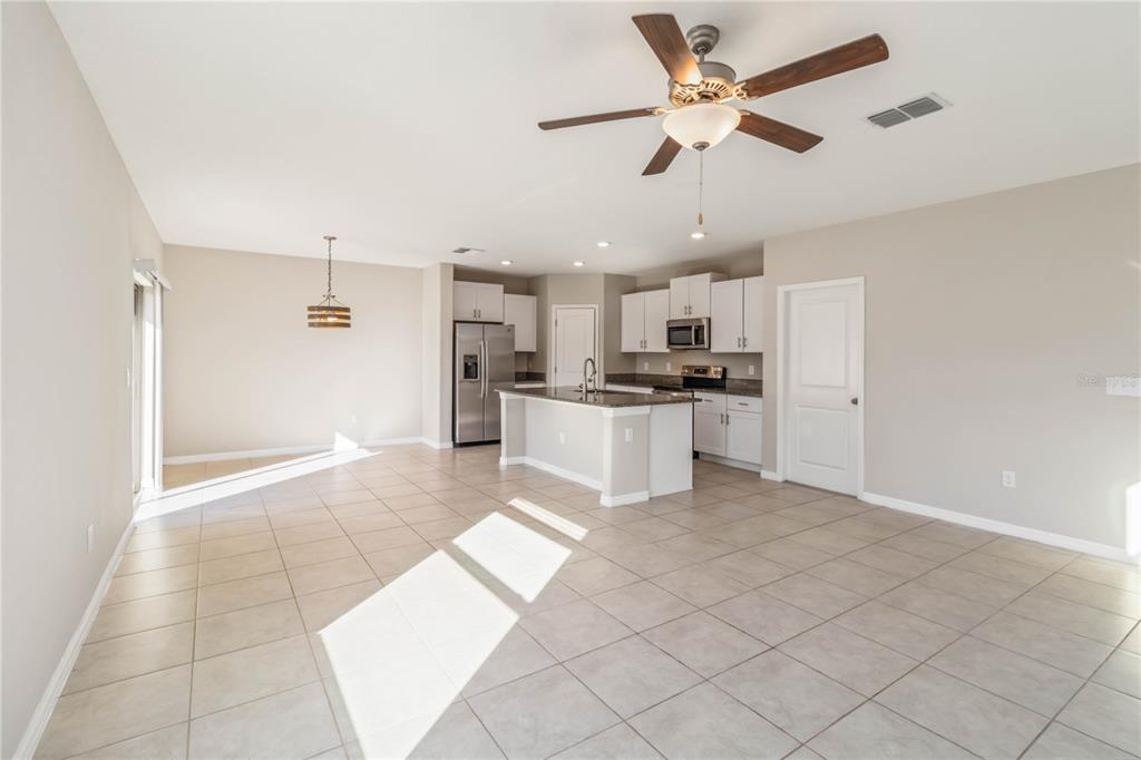 1777 Fred Ives Street Ruskin, FL 33570 - Photo 7 of 35 a view of a kitchen with a sink and a stove top oven