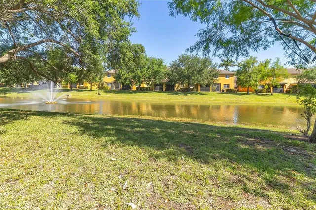 a bedroom with a bed a couch and a window