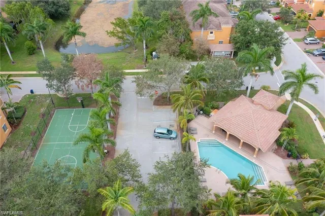 an aerial view of house with yard swimming pool and outdoor seating