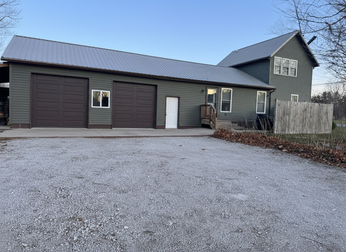912 East Locust Street Fairbury, IL 61739 - Photo 3 of 4 a front view of a house with large trees