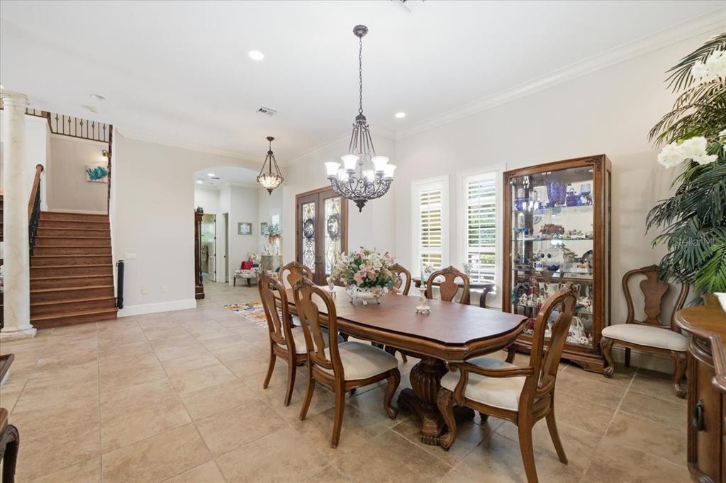 18258 Wayne Road Odessa, FL 33556 - Photo 16 of 100 a view of a dining room with furniture and chandelier