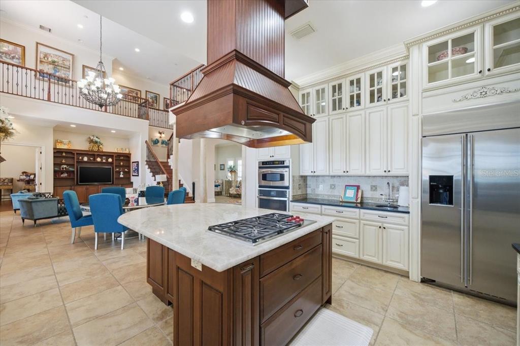 18258 Wayne Road Odessa, FL 33556 - Photo 20 of 100 a kitchen with a counter space a sink stainless steel appliances and cabinets