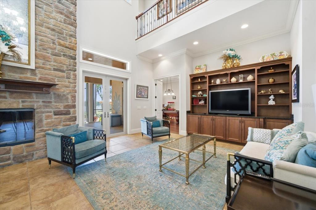 18258 Wayne Road Odessa, FL 33556 - Photo 25 of 100 a living room with furniture and a fireplace