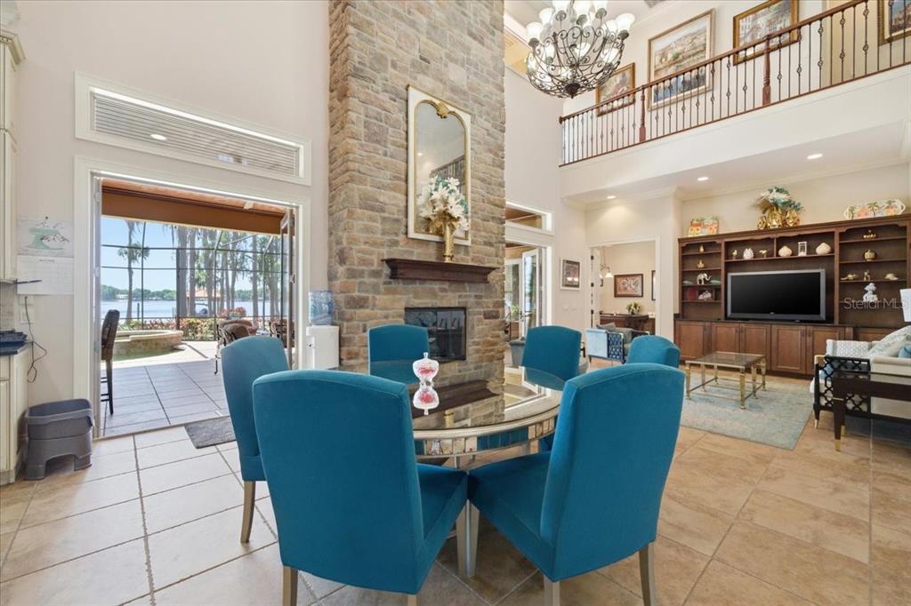 18258 Wayne Road Odessa, FL 33556 - Photo 30 of 100 a living room with furniture a flat screen tv and a fireplace