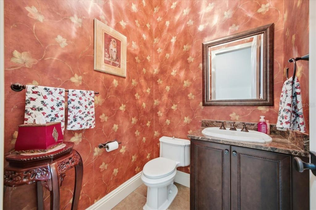 18258 Wayne Road Odessa, FL 33556 - Photo 34 of 100 a bathroom with a toilet sink vanity and mirror