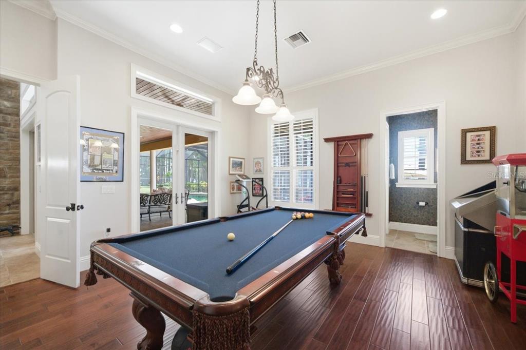 18258 Wayne Road Odessa, FL 33556 - Photo 36 of 100 a room with pool table and windows