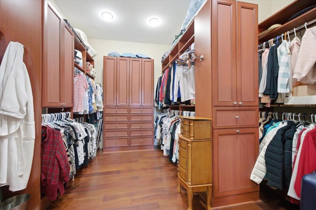 18258 Wayne Road Odessa, FL 33556 - Photo 48 of 100 a view of walk in closet with clothes and shoes