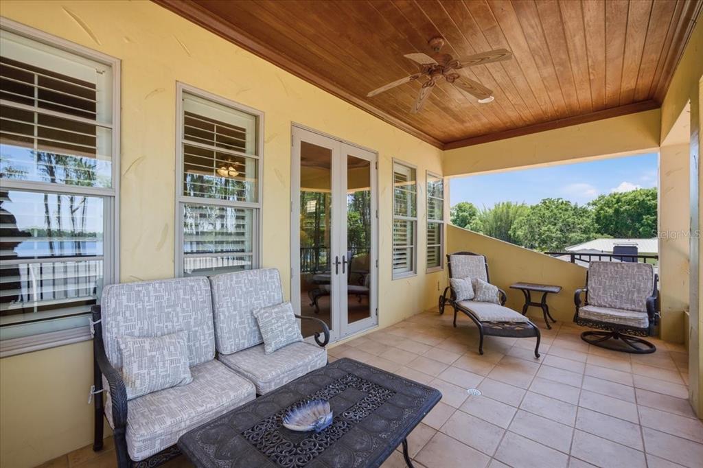 18258 Wayne Road Odessa, FL 33556 - Photo 52 of 100 a outdoor living space with furniture and a ceiling fan