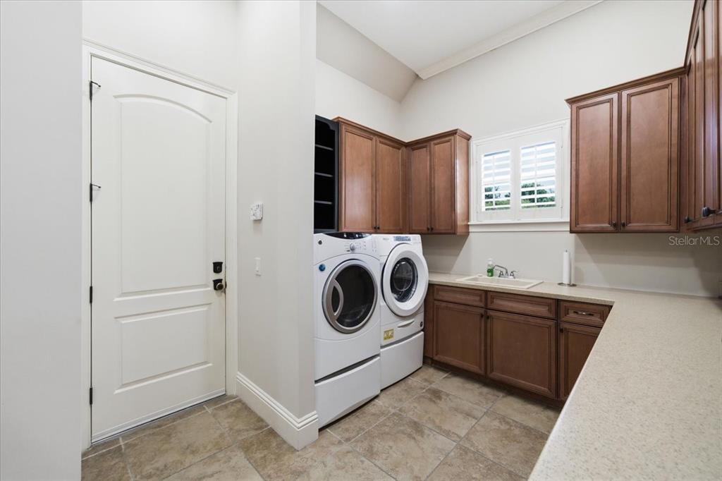 18258 Wayne Road Odessa, FL 33556 - Photo 62 of 100 a utility room with sink dryer and washer