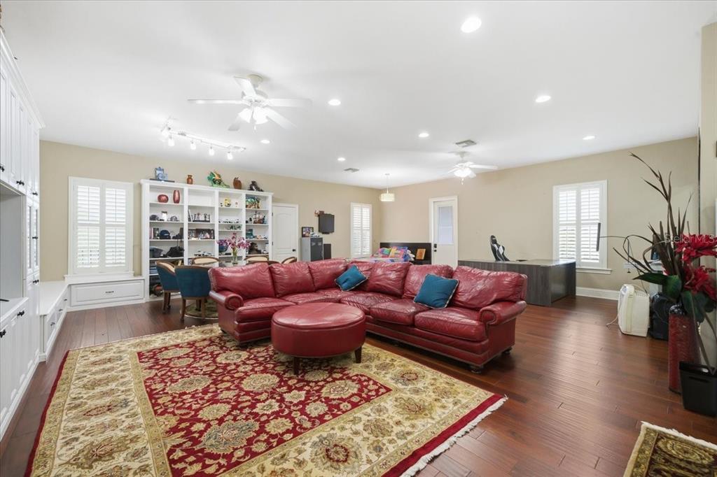 18258 Wayne Road Odessa, FL 33556 - Photo 65 of 100 a living room with furniture or couch and a potted plant