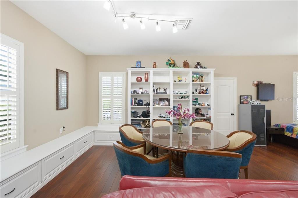 18258 Wayne Road Odessa, FL 33556 - Photo 66 of 100 a dining room with furniture and wooden floor