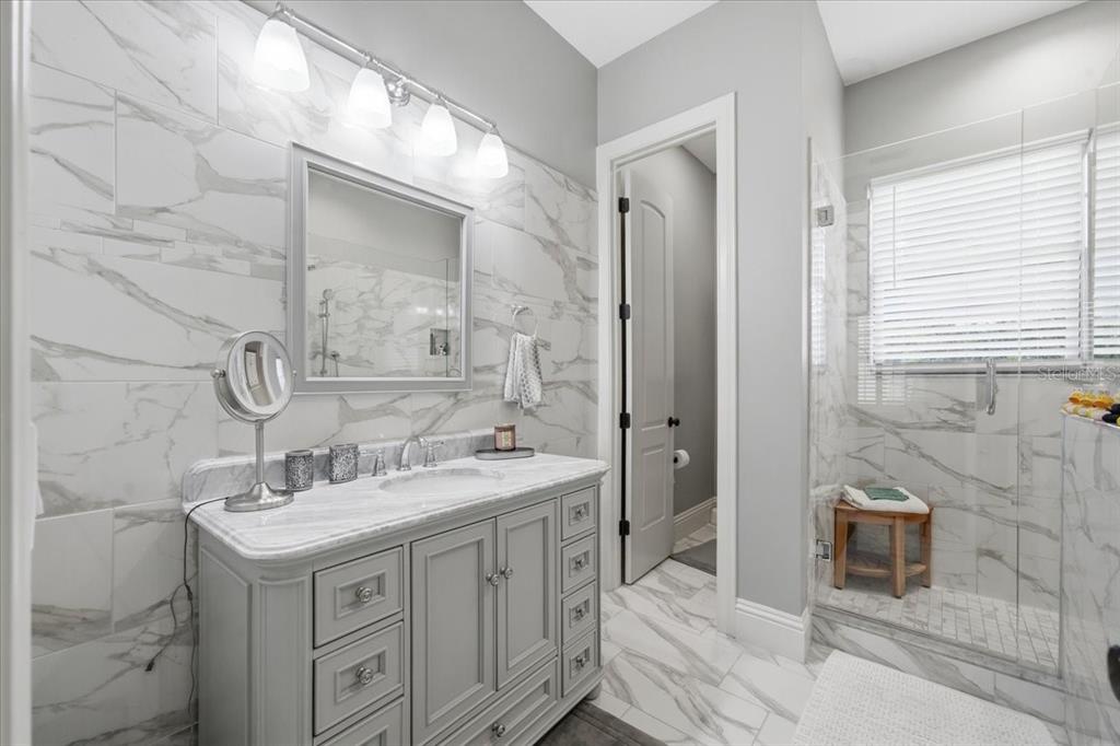 18258 Wayne Road Odessa, FL 33556 - Photo 69 of 100 a bathroom with a sink double vanity and a mirror