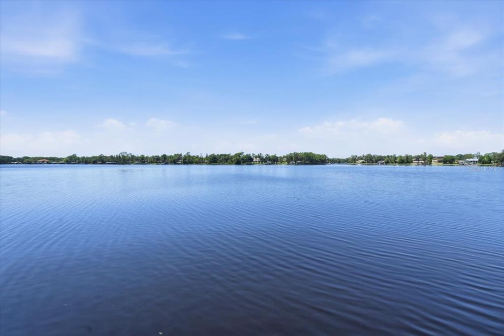 18258 Wayne Road Odessa, FL 33556 - Photo 91 of 100 a view of a lake with sunset in background