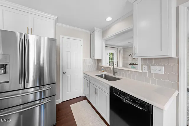 a stove top oven sitting inside of a kitchen
