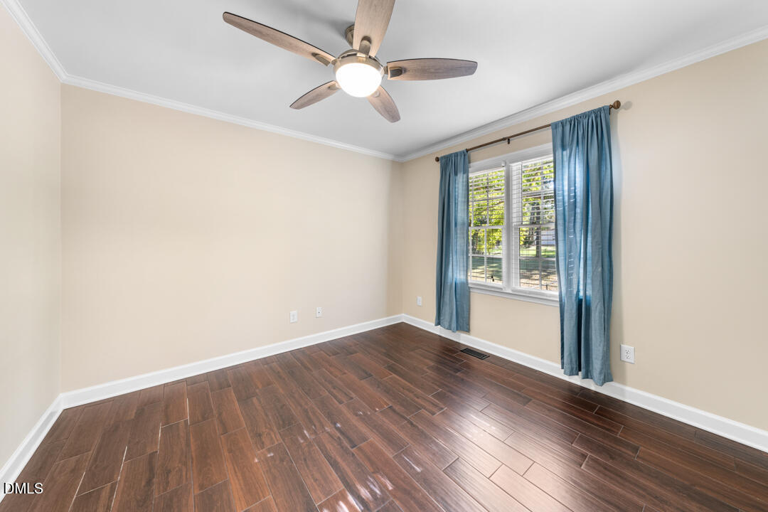 405 Latta Road Durham, NC 27712 - Photo 27 of 43 wooden floor in an empty room with a window