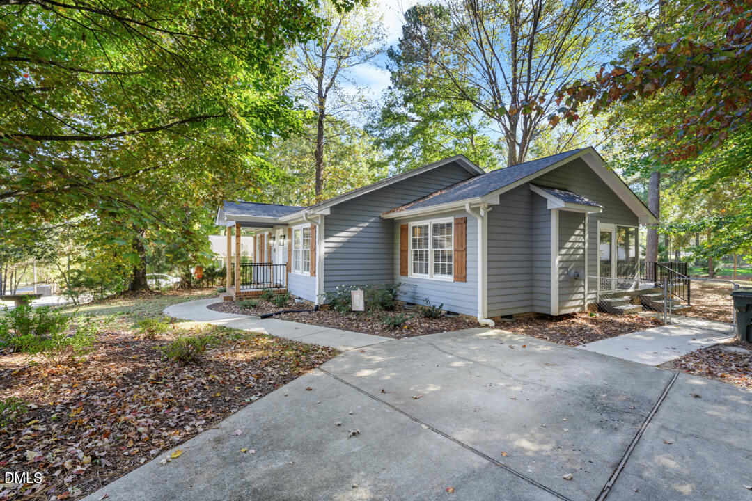 405 Latta Road Durham, NC 27712 - Photo 4 of 43 a front view of a house with garden
