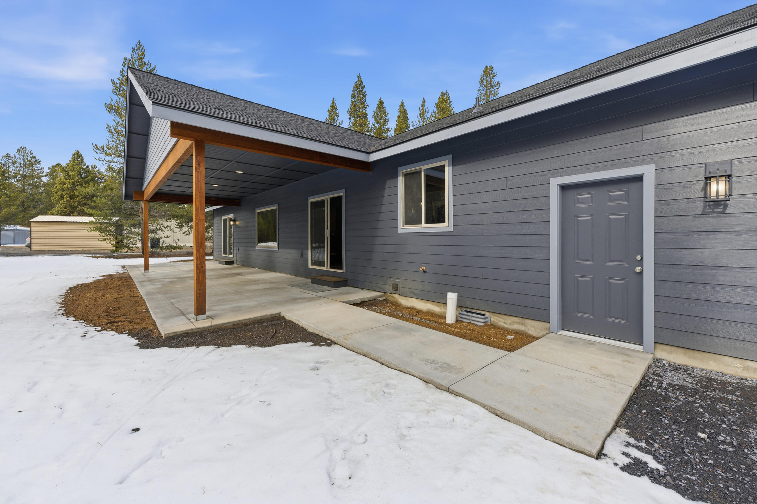 16083 Dyke Road, Unit 9 La Pine, OR 97739 - Photo 41 of 53 a view of a house with backyard and porch