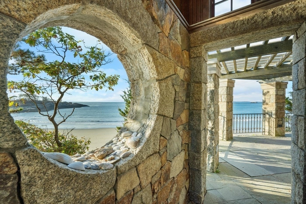 239 Summer Street Manchester, MA 01944 - Photo 11 of 42 a vase of flowers sitting on a table