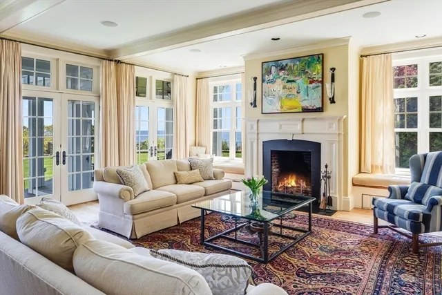 a view of a dining room with furniture a chandelier and wooden floor