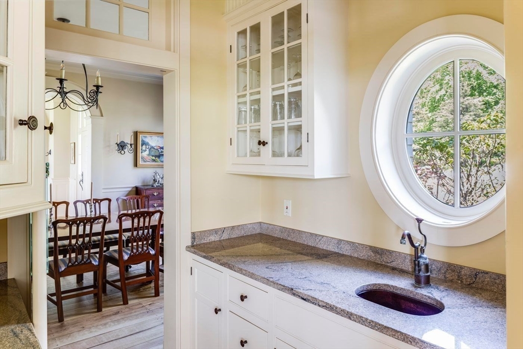 239 Summer Street Manchester, MA 01944 - Photo 23 of 42 a bathroom with a sink and a mirror