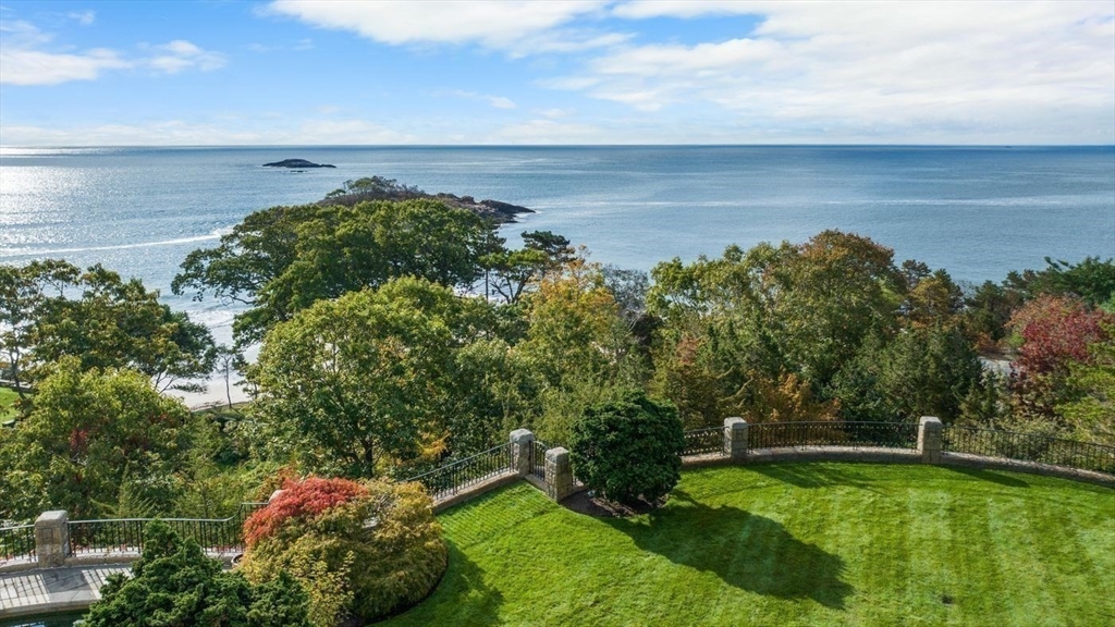 239 Summer Street Manchester, MA 01944 - Photo 25 of 42 a view of a lake with a yard