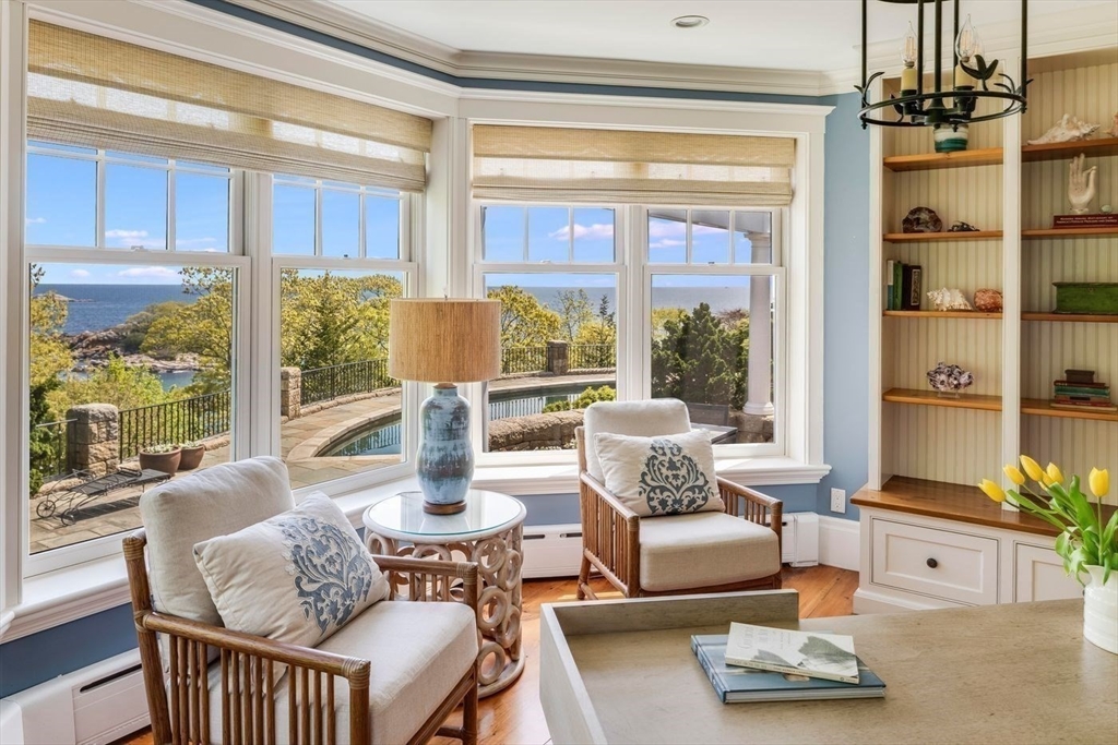 239 Summer Street Manchester, MA 01944 - Photo 27 of 42 a living room with furniture and floor to ceiling windows