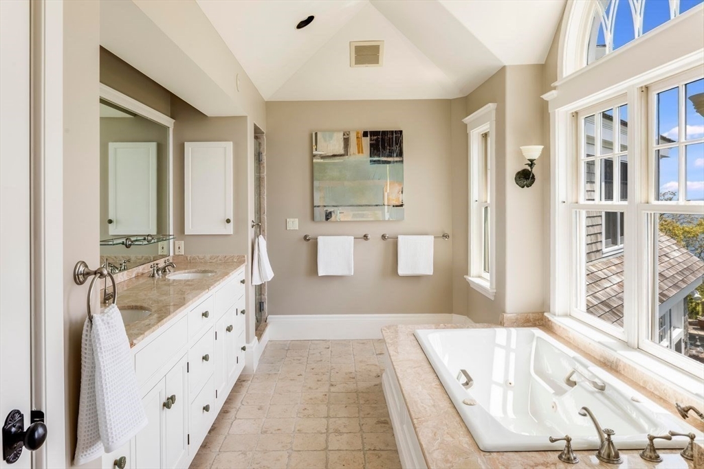 239 Summer Street Manchester, MA 01944 - Photo 34 of 42 a bathroom with a tub sink and mirror