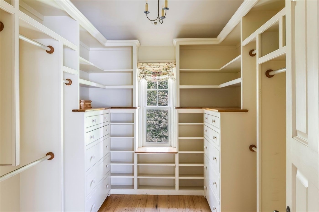 239 Summer Street Manchester, MA 01944 - Photo 35 of 42 a view of walk in closet with empty racks