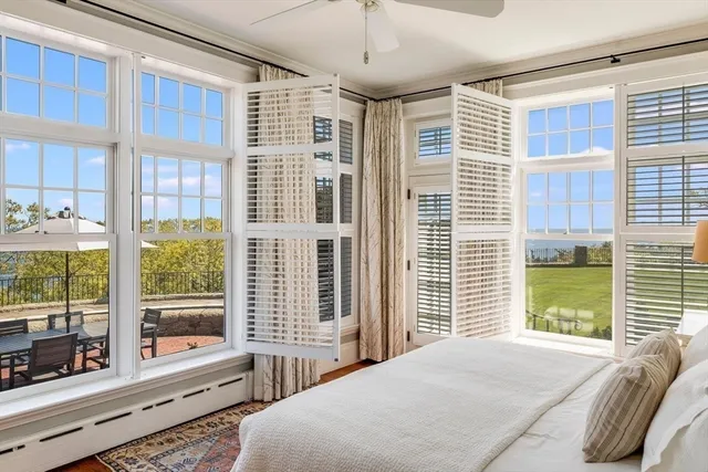 a bathroom with a granite countertop sink and a large mirror
