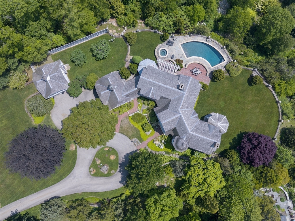 239 Summer Street Manchester, MA 01944 - Photo 40 of 42 an aerial view of a house with a swimming pool outdoor seating and yard
