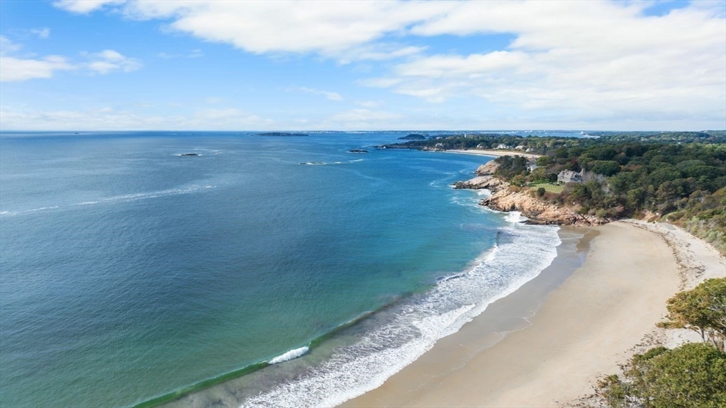239 Summer Street Manchester, MA 01944 - Photo 42 of 42 a view of a lake with beach and city view