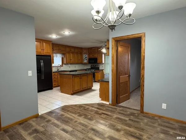a view of a kitchen with a sink and stainless steel appliances
