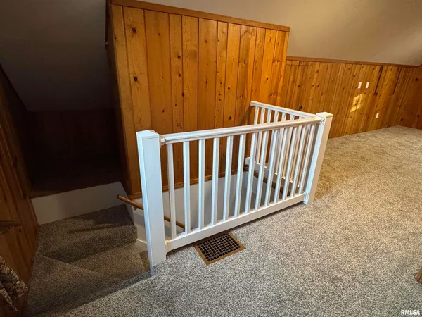 a view of a porch with wooden floor