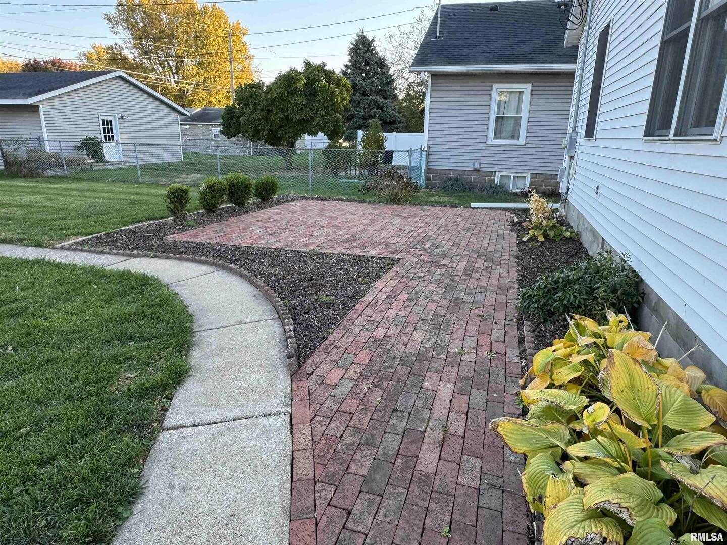 1020 Brown Street Bettendorf, IA 52722 - Photo 25 of 29 a view of a house with a backyard