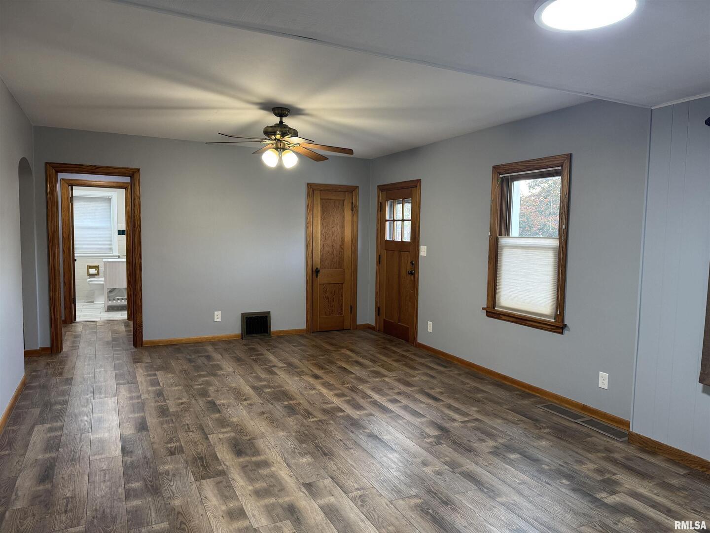 1020 Brown Street Bettendorf, IA 52722 - Photo 5 of 29 an empty room with windows and fan