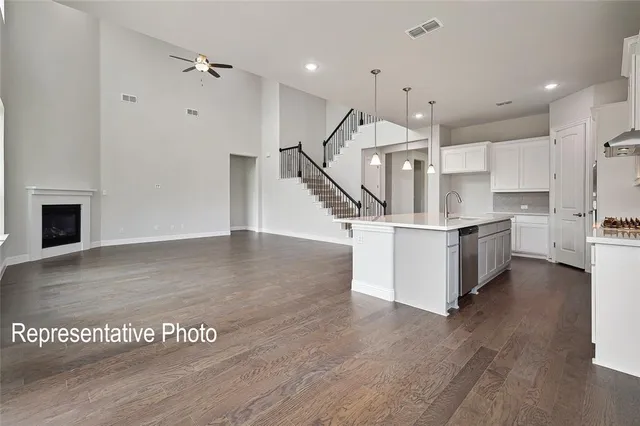 a view of kitchen with furniture and wooden floor