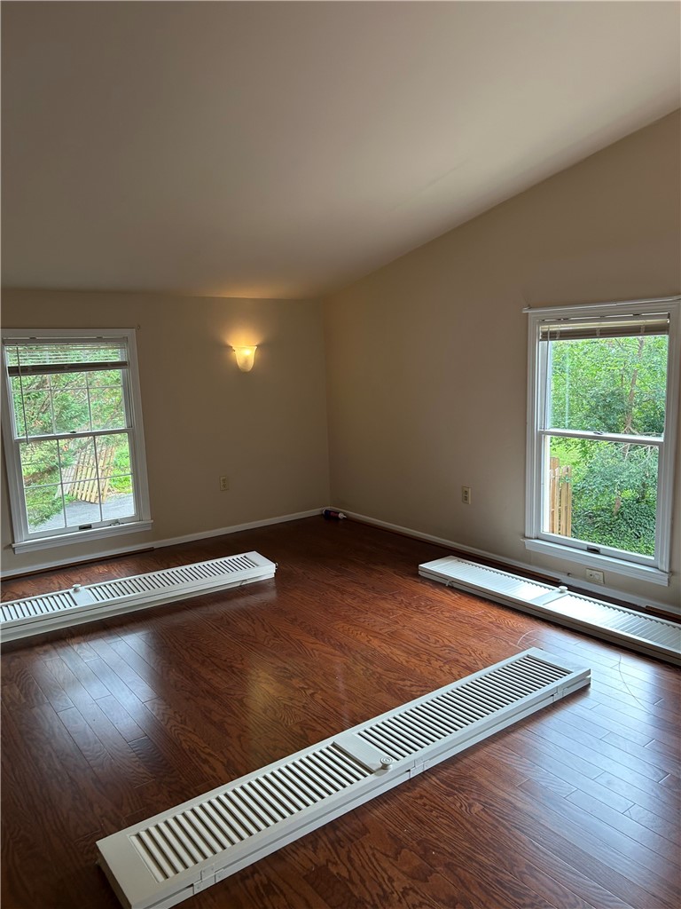 110 North Broad Street Pendleton, SC 29670 - Photo 27 of 32 Rich hardwood floors complement the natural light streaming into this versatile room.