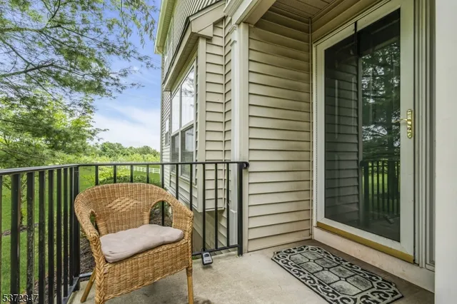 a balcony with a glass door