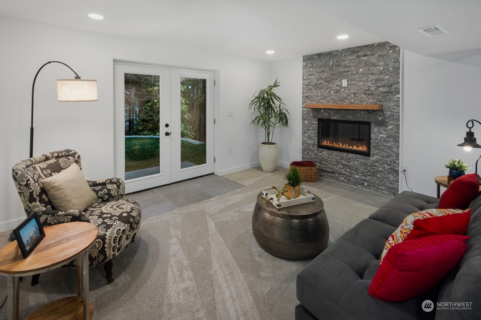 233 Poppy Road Bothell, WA 98012 - Photo 17 of 36 a living room with furniture and a fireplace