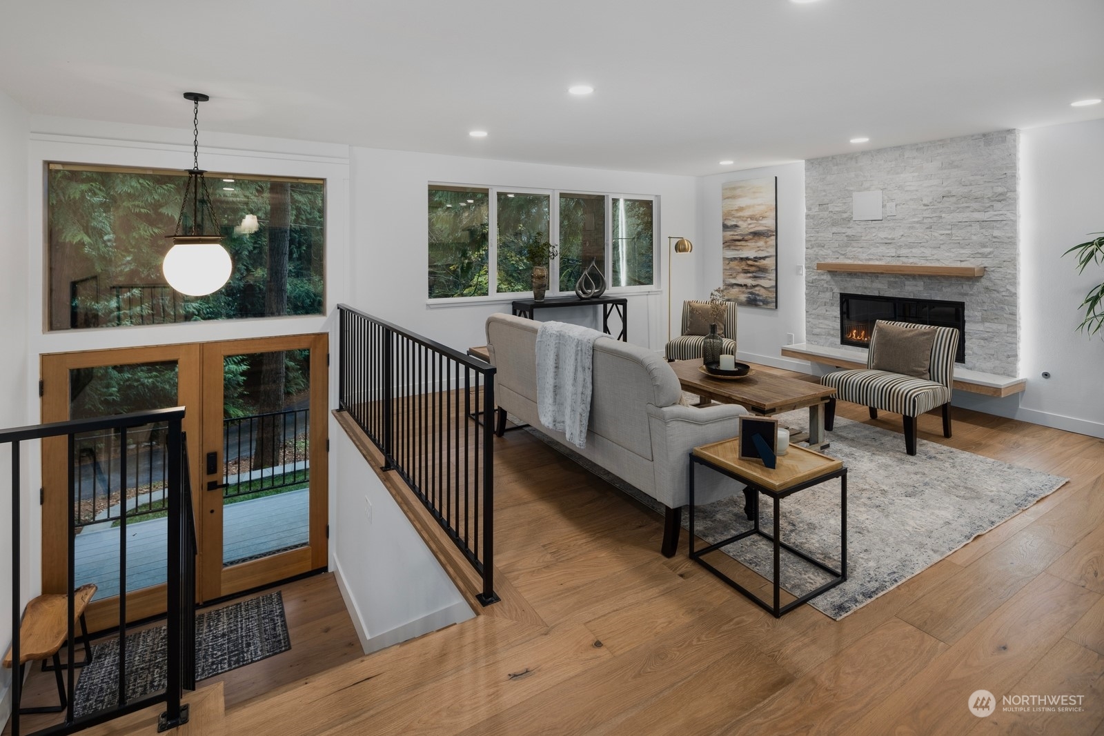 233 Poppy Road Bothell, WA 98012 - Photo 2 of 36 a living room with furniture and a wooden floor