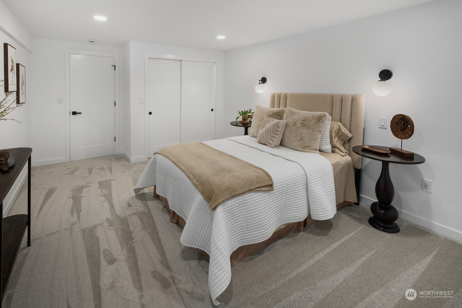 233 Poppy Road Bothell, WA 98012 - Photo 21 of 36 a spacious bedroom with a bed and a table