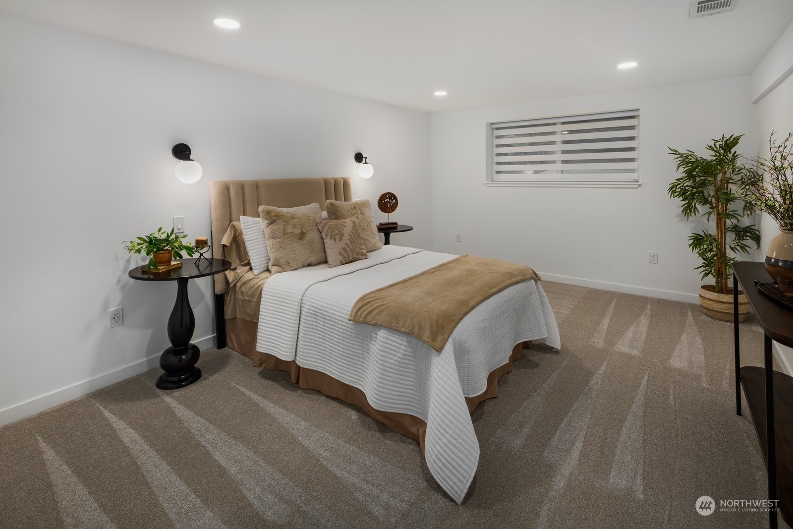 233 Poppy Road Bothell, WA 98012 - Photo 22 of 36 a bed room with a bed and a potted plant