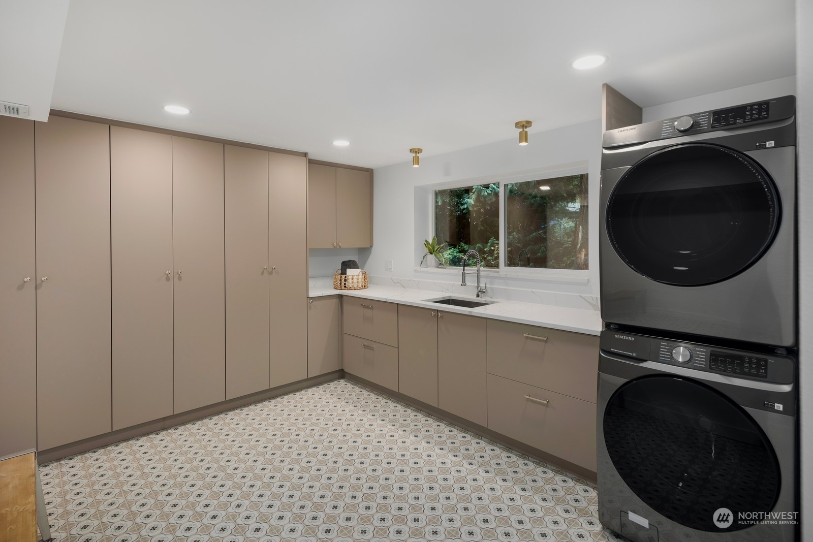 233 Poppy Road Bothell, WA 98012 - Photo 26 of 36 a view of a kitchen with a sink and a washer dryer