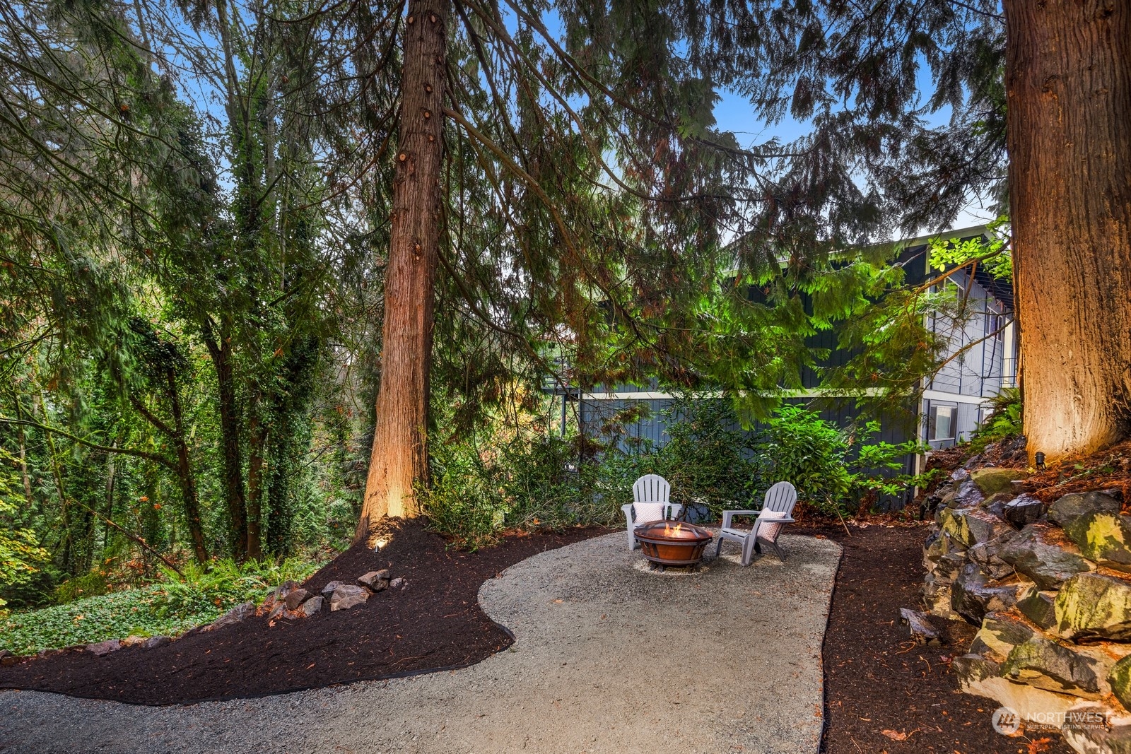 233 Poppy Road Bothell, WA 98012 - Photo 30 of 36 a view of a patio with table and chairs and a large tree