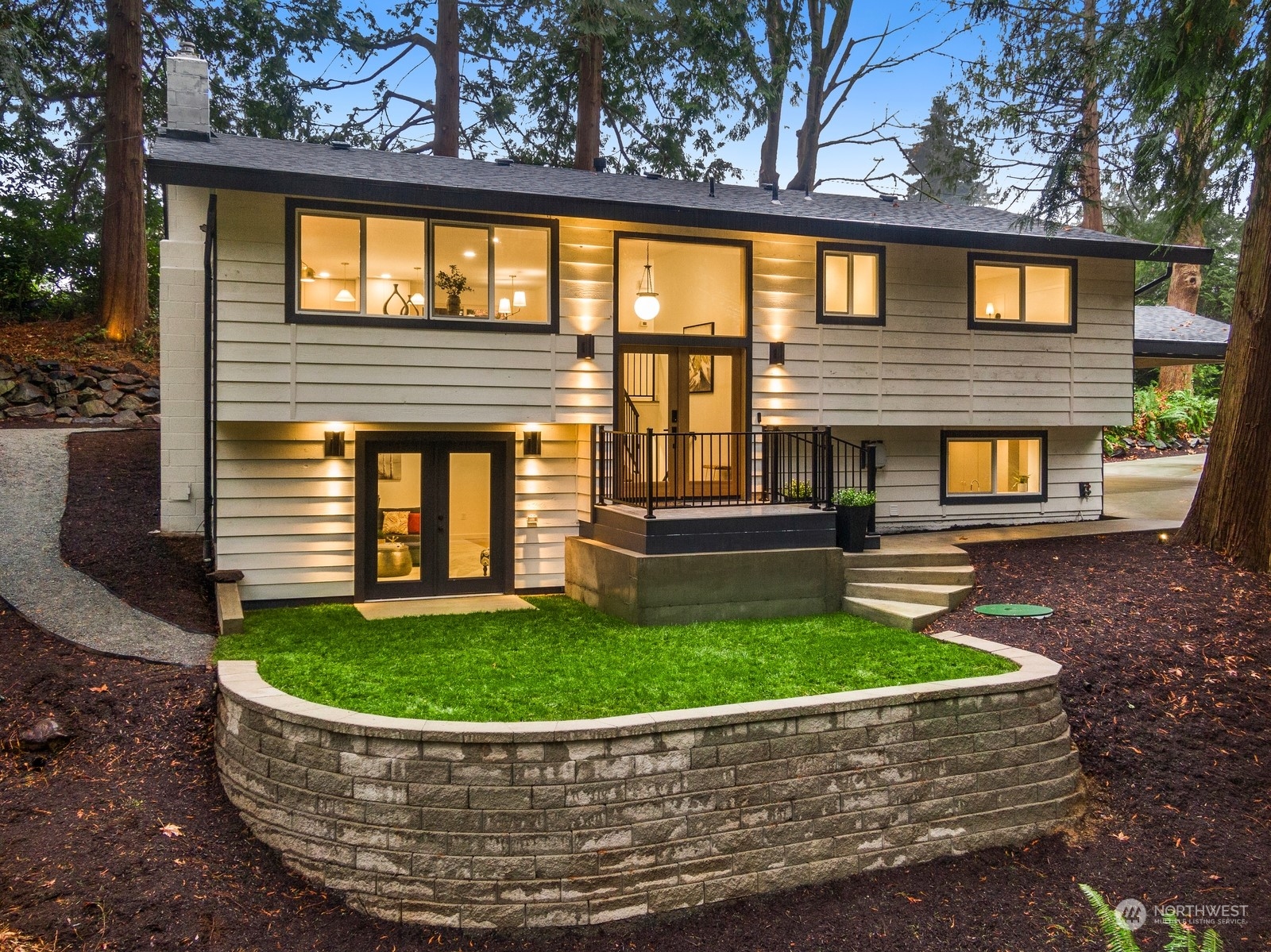 233 Poppy Road Bothell, WA 98012 - Photo 36 of 36 a view of a house with a small yard plants and large tree