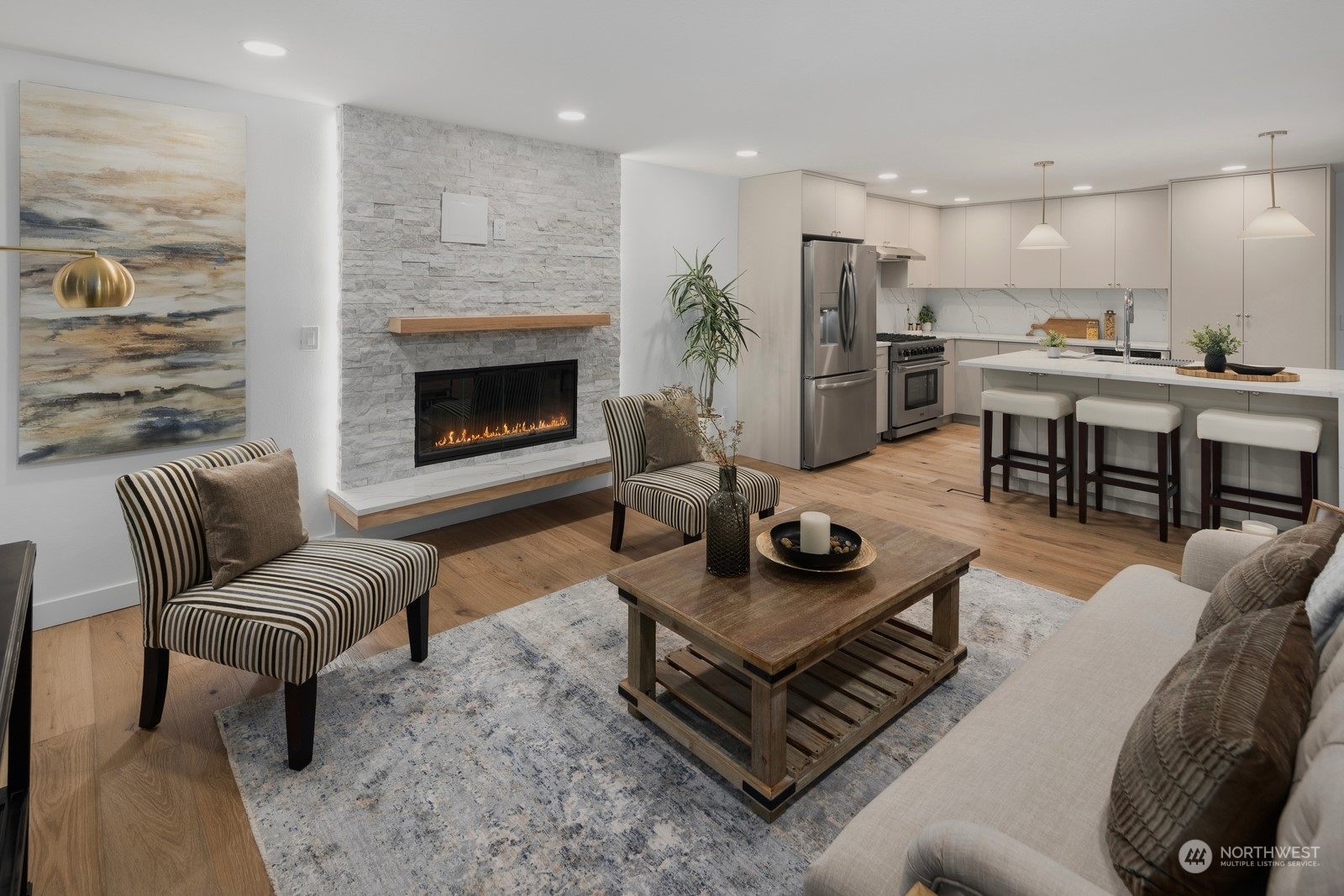 233 Poppy Road Bothell, WA 98012 - Photo 4 of 36 a living room with furniture and a fireplace