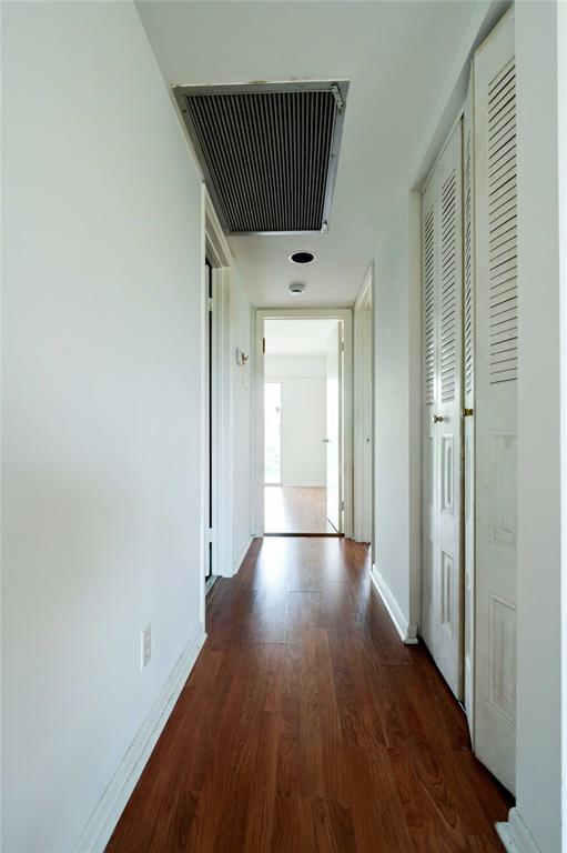 300 Southwest 134th Way, Unit 402E Pembroke Pines, FL 33027 - Photo 11 of 46 a view of hallway with wooden floor