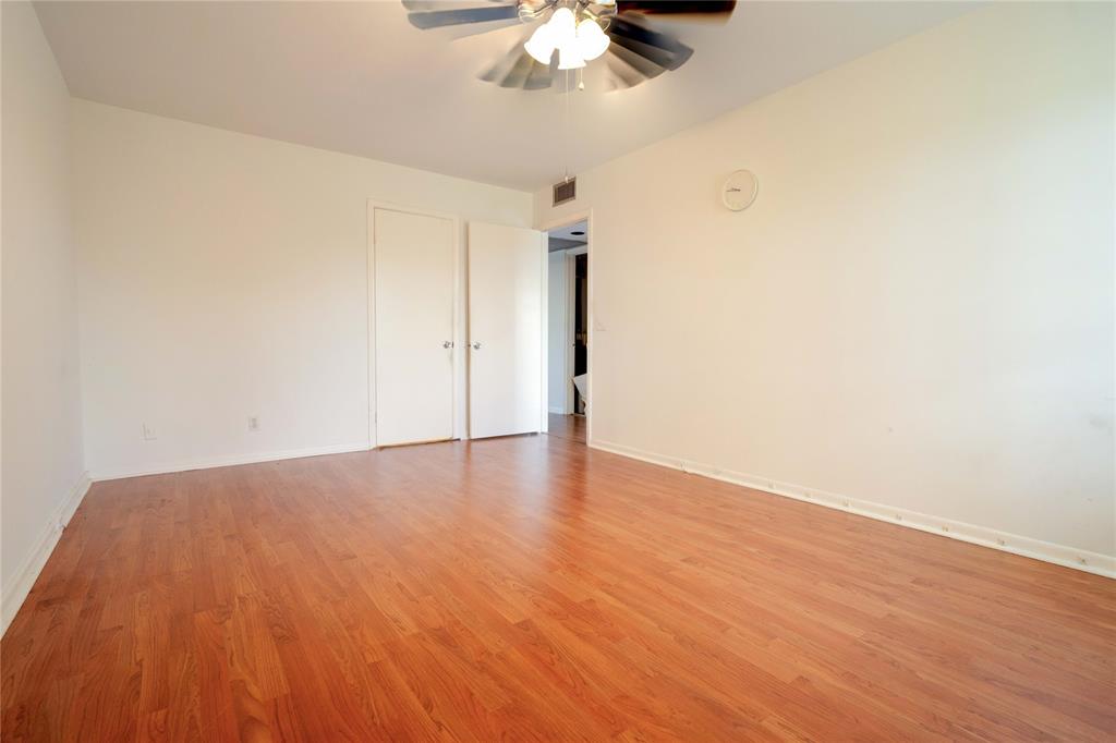 300 Southwest 134th Way, Unit 402E Pembroke Pines, FL 33027 - Photo 15 of 46 a view of an empty room with wooden floor