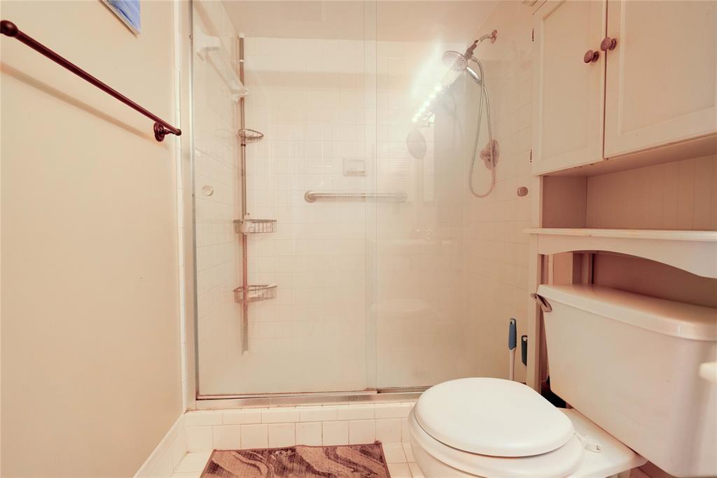 300 Southwest 134th Way, Unit 402E Pembroke Pines, FL 33027 - Photo 18 of 46 a white toilet sitting next to a bathroom sink